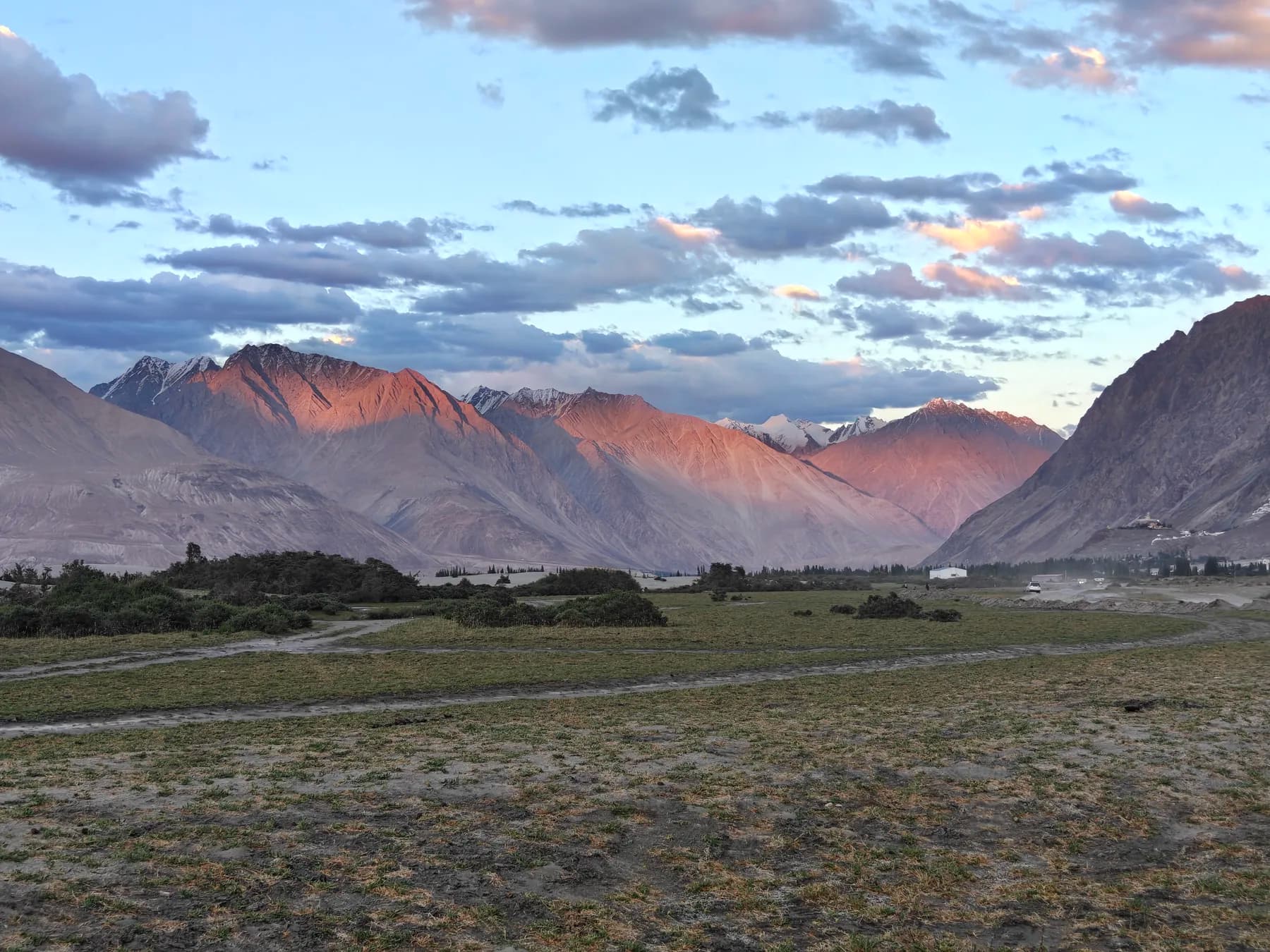 Pink sunset light on the peaks above Nubra Valley