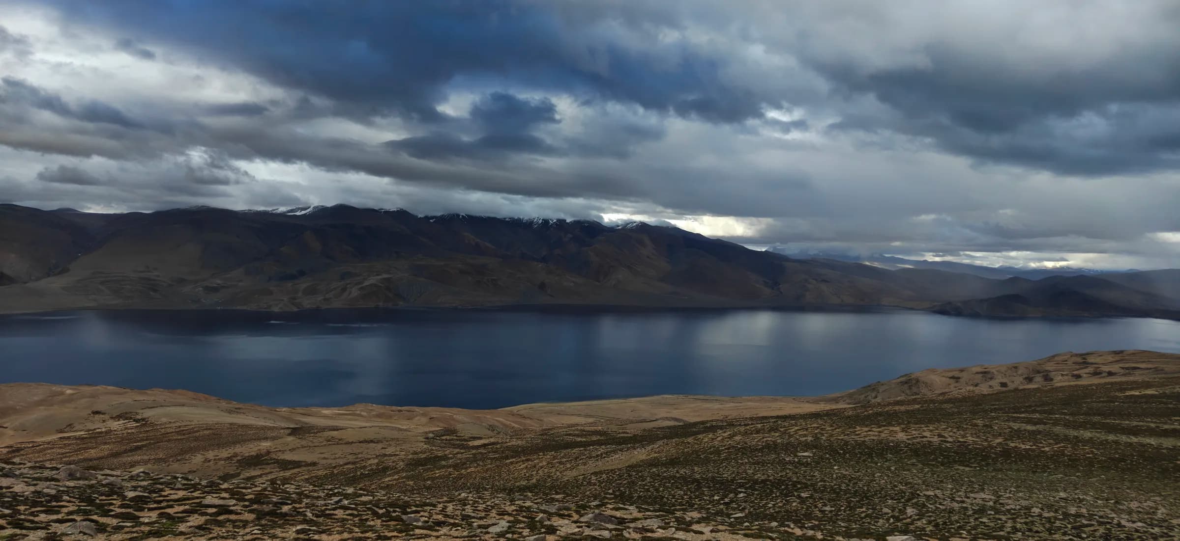 Panorama of a deep blue high-altitude lake